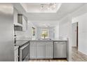 Updated kitchen showcasing stainless steel appliances, granite counters, and ample cabinet space at 13250 Ridge Rd # 2-1, Largo, FL 33778