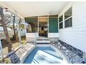 Enclosed porch with access to the home and backyard at 2331 Belleair Rd # 116, Clearwater, FL 33764