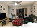 Living room with Christmas tree, sofa, and TV at 2302 Maki Rd # 5, Plant City, FL 33563