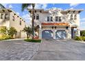 Two-story house with a two-car garage and a paved driveway at 102 S Moody Ave # 3, Tampa, FL 33609