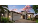 Beautiful one-story home with brick paver driveway and landscaping at 23503 Waverly Cir, Venice, FL 34293