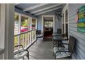 Relaxing screened porch with seating and view of street at 485 11Th N Ave, St Petersburg, FL 33701