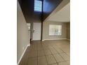 Bright and spacious entryway with tile flooring and a staircase at 11005 Laurel Brook Ct, Riverview, FL 33569