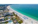 Aerial view of a beautiful beach front condos on a white sand beach with crystal clear water at 400 64Th Ave # 908, St Pete Beach, FL 33706