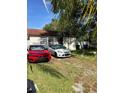 Well-maintained home with a grassy yard and off-street parking at 8218 N 18Th St, Tampa, FL 33604