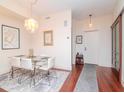 Elegant dining area with hardwood floors and modern chandelier at 111 N 12Th St # 1708, Tampa, FL 33602