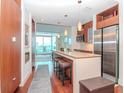 Modern kitchen with granite countertops and stainless steel appliances at 111 N 12Th St # 1708, Tampa, FL 33602