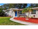 Updated single story home with attractive landscaping and walkway at 2152 74Th N St, St Petersburg, FL 33710