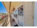 Close view of the condo's front porch, showcasing secure door and natural light at 4001 58Th N St # 20, Kenneth City, FL 33709