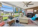 Cozy sunroom with stained glass windows and a fireplace at 5421 Mohawk St, Zephyrhills, FL 33542