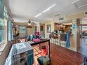 Living room with hardwood floors, open kitchen, and lots of natural light at 133 80Th N Ave, St Petersburg, FL 33702