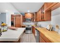 Bright kitchen with wood cabinets, stainless steel appliances, and a large island at 5021 69Th N Way, St Petersburg, FL 33709