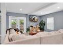 Spacious living room with comfortable seating and large TV at 5021 69Th N Way, St Petersburg, FL 33709