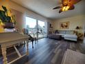 Living room featuring hardwood floors, and ample natural light at 1707 New Bedford Dr, Sun City Center, FL 33573