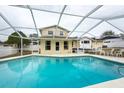 Inviting screened-in pool with a view of the house at 813 Kingswood Pl, Brandon, FL 33511