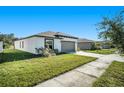 New construction home with grassy yard at 39822 Harmon Grove Ct, Zephyrhills, FL 33540