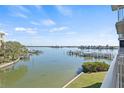 Beautiful water view from the balcony of the harbor, boats, and other waterfront homes at 399 150Th Ave # A203, Madeira Beach, FL 33708