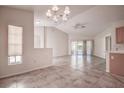 Spacious dining area with tile floors and a chandelier at 29417 Caddyshack Ln, San Antonio, FL 33576