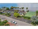Two-story home with private tennis court and waterfront access at 5029 W San Miguel St, Tampa, FL 33629