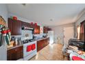 View of a well-lit kitchen, showcasing dark wood cabinets and granite countertops at 2045 18Th S Ave, St Petersburg, FL 33712