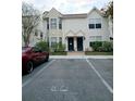 Front view of a two-story townhouse with parking at 2302 Maki Rd # 62, Plant City, FL 33563