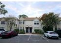 Two-story townhouse exterior with parking spaces at 2302 Maki Rd # 62, Plant City, FL 33563