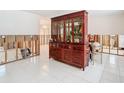 Dining room with a large wooden hutch and renovations in progress at 4740 114Th N St, St Petersburg, FL 33708