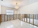 Dining room undergoing renovations, showing exposed walls at 4740 114Th N St, St Petersburg, FL 33708
