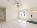 Bright living room with tile floors and a ceiling fan at 14181 89Th Ave, Seminole, FL 33776