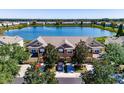 Townhome community with lake view; subject property has a two-car garage at 4904 Barnstead Dr, Riverview, FL 33578