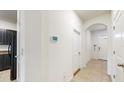 Clean hallway with tile floors and access to rooms at 835 Lucent Sands Ct, Brandon, FL 33511