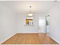 Simple dining area with light walls and wood-look flooring at 2122 Hereford Dr # 511, Sun City Center, FL 33573
