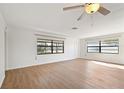 Bright living room featuring light walls and wood-look floors at 2122 Hereford Dr # 511, Sun City Center, FL 33573