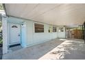 Covered carport next to the house entrance at 3918 W Fig St, Tampa, FL 33609
