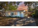 Charming single-story home with a covered carport and driveway in a quiet neighborhood at 3918 W Fig St, Tampa, FL 33609