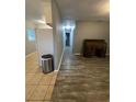 Long hallway with wood-look floors and access to rooms at 4315 Berkley Dr, Tampa, FL 33610
