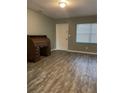 Living room featuring wood-look floors and a classic desk at 4315 Berkley Dr, Tampa, FL 33610