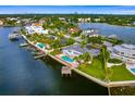 Waterfront home with pool and private dock, aerial view at 5033 W San Miguel St, Tampa, FL 33629