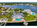 Bird's-eye view of waterfront property, showcasing the house and pool at 5033 W San Miguel St, Tampa, FL 33629