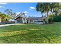 Ranch-style home with updated exterior and lush lawn at 5472 Cactus Cir, Spring Hill, FL 34606