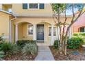 Home's front entrance with a walkway and landscaping at 6922 Hawthorne Trace Ln, Riverview, FL 33578