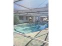 View of the kidney shaped swimming pool from another angle at 1147 Viking Dr, Holiday, FL 34691