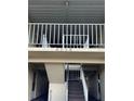 Exterior view of building entrance with stairs and balcony at 4854 Marine Parkway # 101, New Port Richey, FL 34652