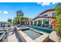 Expansive pool and spa area with patio furniture, offering waterfront views at 747 Brightwaters Ne Blvd, St Petersburg, FL 33704