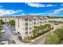 Aerial view of The Avalon condo building, showing parking and landscaping at 1216 S Missouri Ave # 308, Clearwater, FL 33756