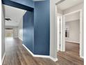 Bright hallway with new flooring, leading to other rooms at 12612 Midpointe Dr, Riverview, FL 33579