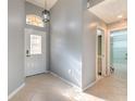 Bright entryway with tile flooring and access to bathroom at 3125 Bent Creek Dr, Valrico, FL 33596