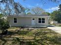 Charming single-story home featuring a well-maintained lawn and neutral siding at 3562 Fisher Rd, Palm Harbor, FL 34683