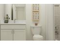 Clean bathroom with white vanity, toilet, and shower at 7036 119Th E Ct, Palmetto, FL 34221