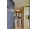 Apartment entryway with tiled floor, leading to living room at 7050 Sunset S Dr # 405, South Pasadena, FL 33707